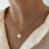 SCALLOPED SHELL ON GOLD CHAIN
